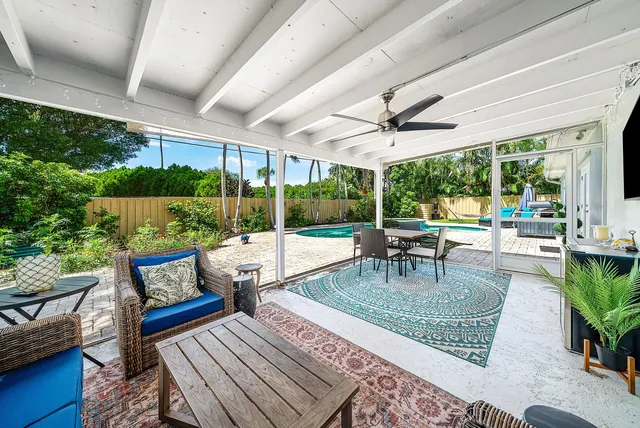 an aerial view of a house with a yard and lake view