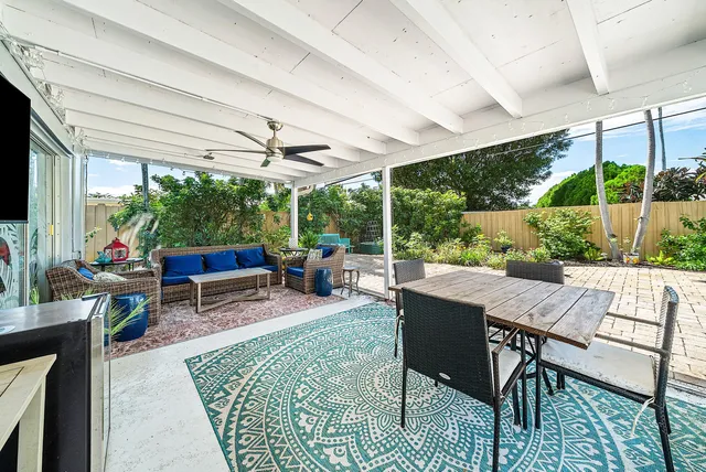 a view of building with yard and swimming pool