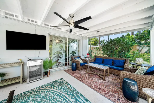 an aerial view of a house with a garden and lake view