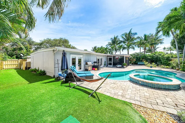 an aerial view of a house with a lake view