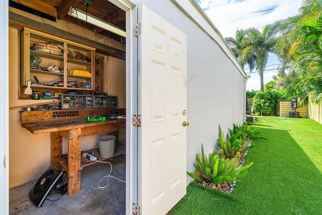 an aerial view of residential house with outdoor space and lake view