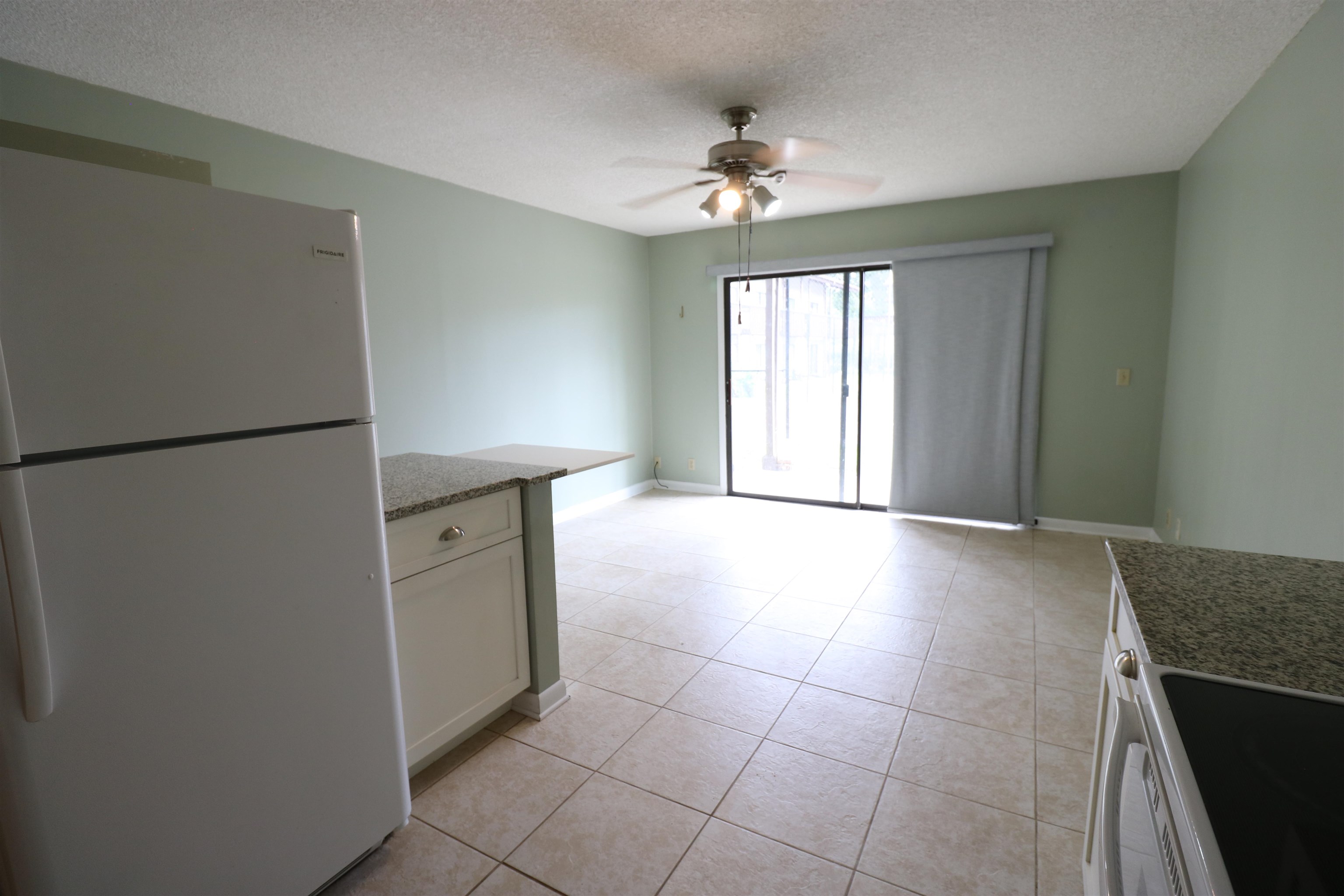 1255 Ponce Island Drive, Unit 739 St. Augustine, FL 32095 - Photo 3 of 10 a view of a kitchen with a sink dishwasher and a refrigerator