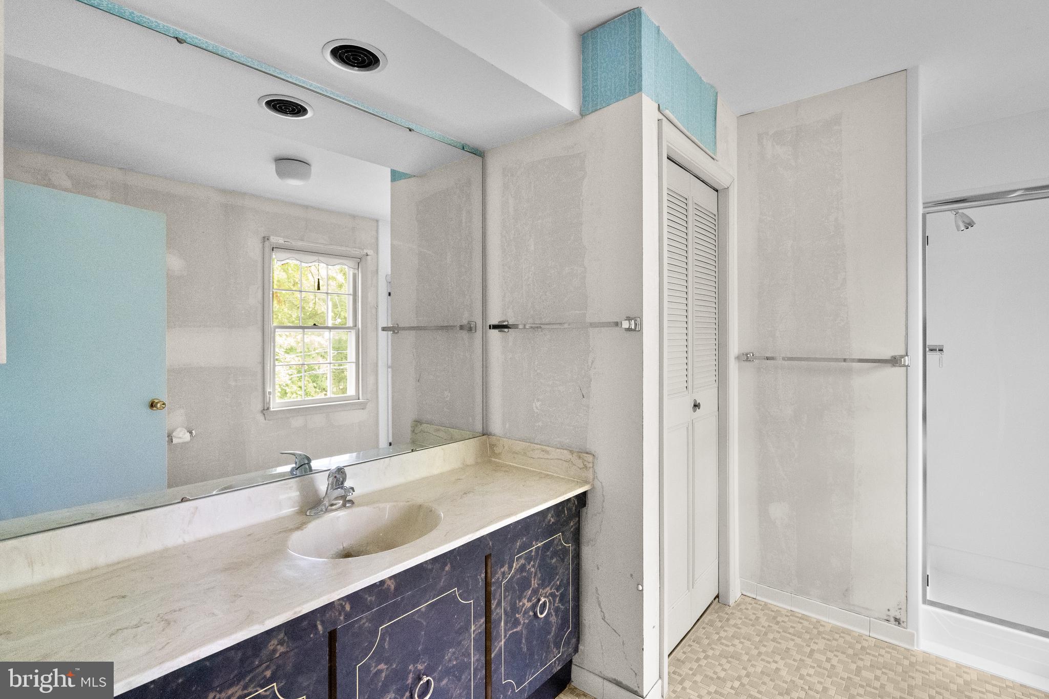 9509 Emory Grove Road Gaithersburg, MD 20877 - Photo 38 of 57 a bathroom with a granite countertop sink mirror and double