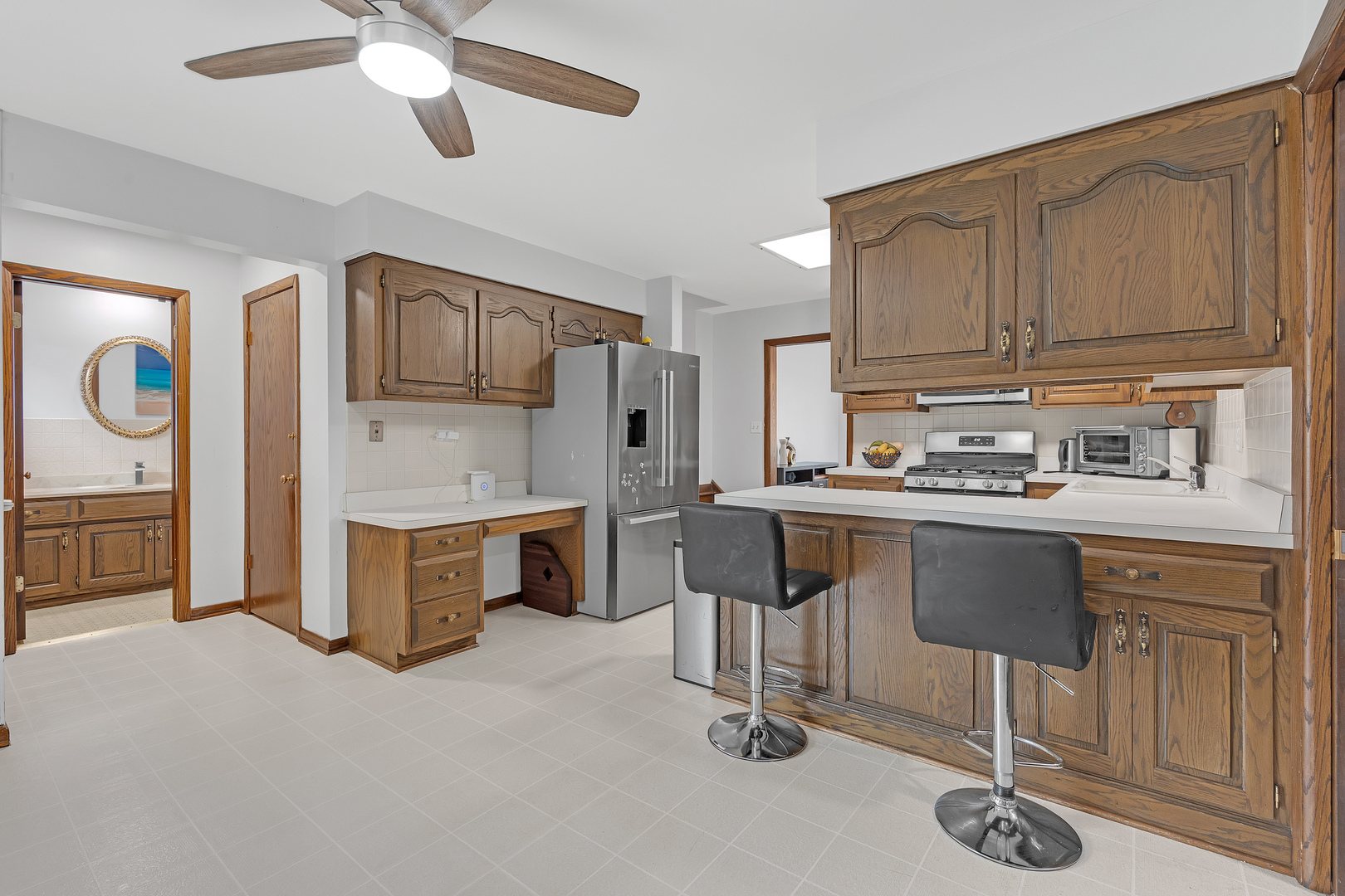 11020 Raleigh Street Westchester, IL 60154 - Photo 8 of 27 a kitchen with a sink cabinets and window