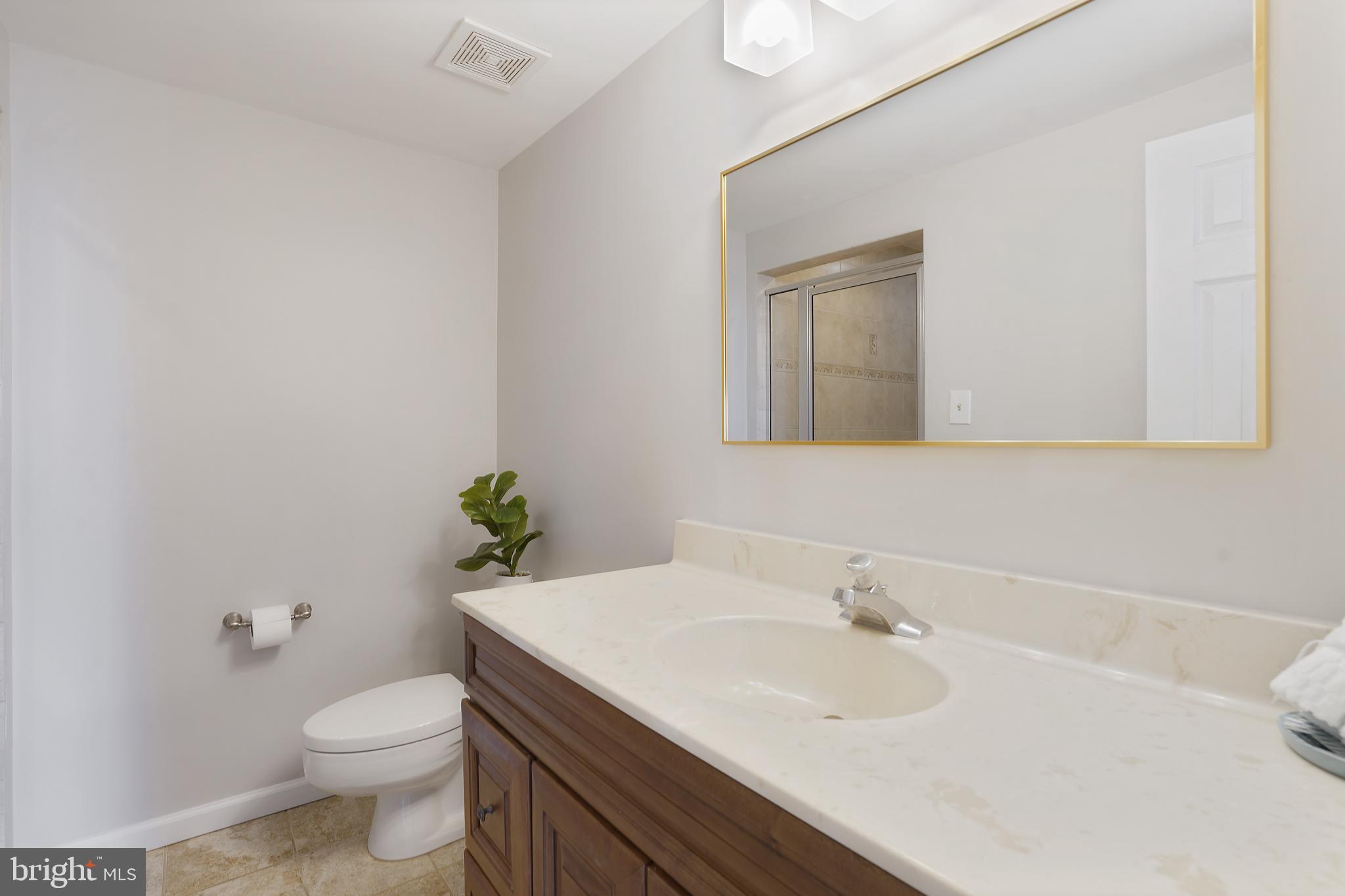 1052 Bellview Road McLean, VA 22102 - Photo 13 of 36 a bathroom with a sink and a toilet
