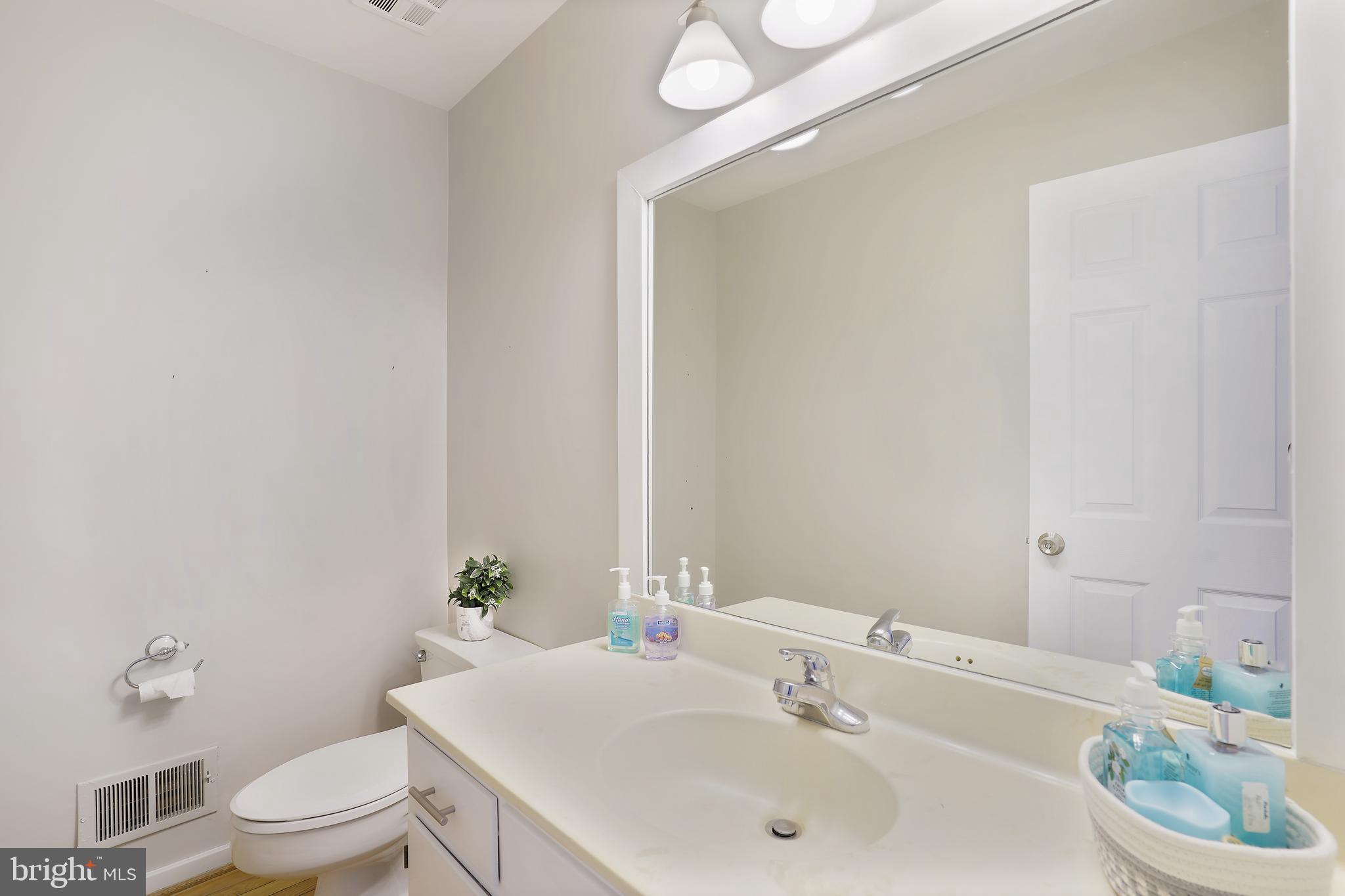1052 Bellview Road McLean, VA 22102 - Photo 15 of 36 a bathroom with a sink and a toilet