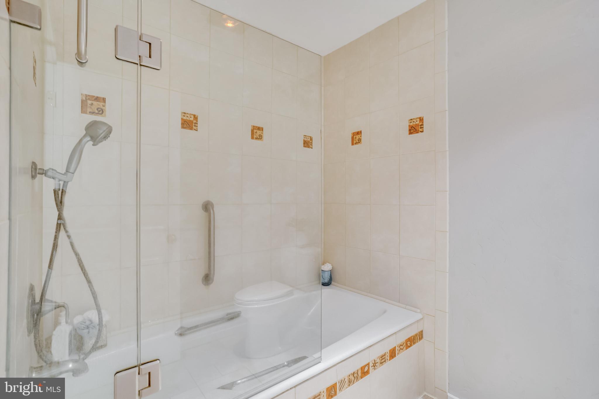 1052 Bellview Road McLean, VA 22102 - Photo 18 of 36 a bathroom with a sink a toilet and shower