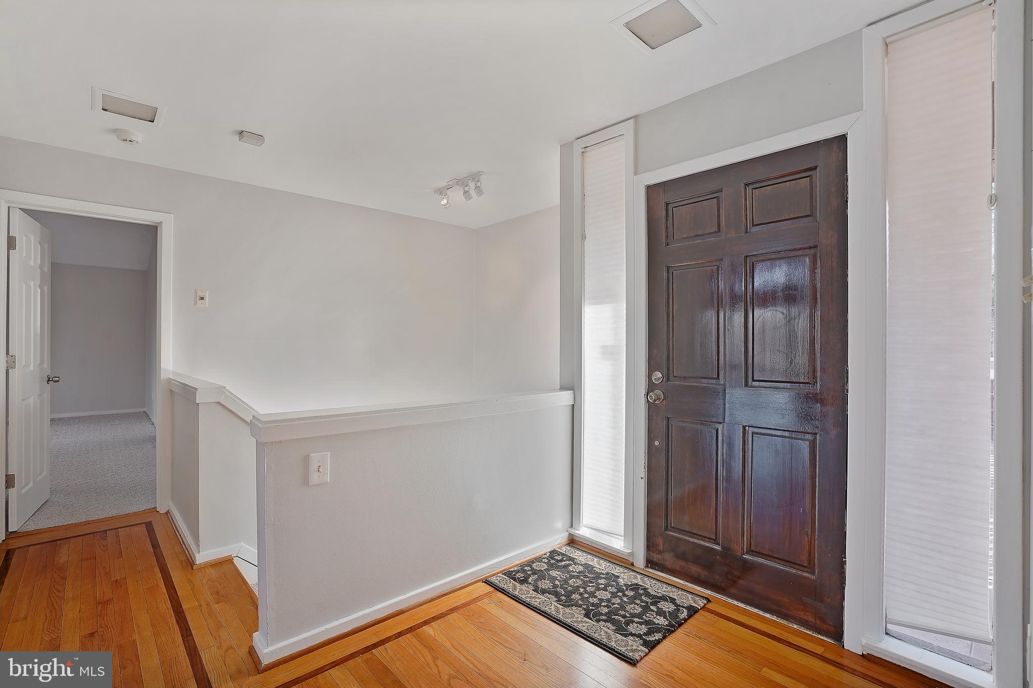 1052 Bellview Road McLean, VA 22102 - Photo 3 of 36 a view of room with walk in closet and wooden floor