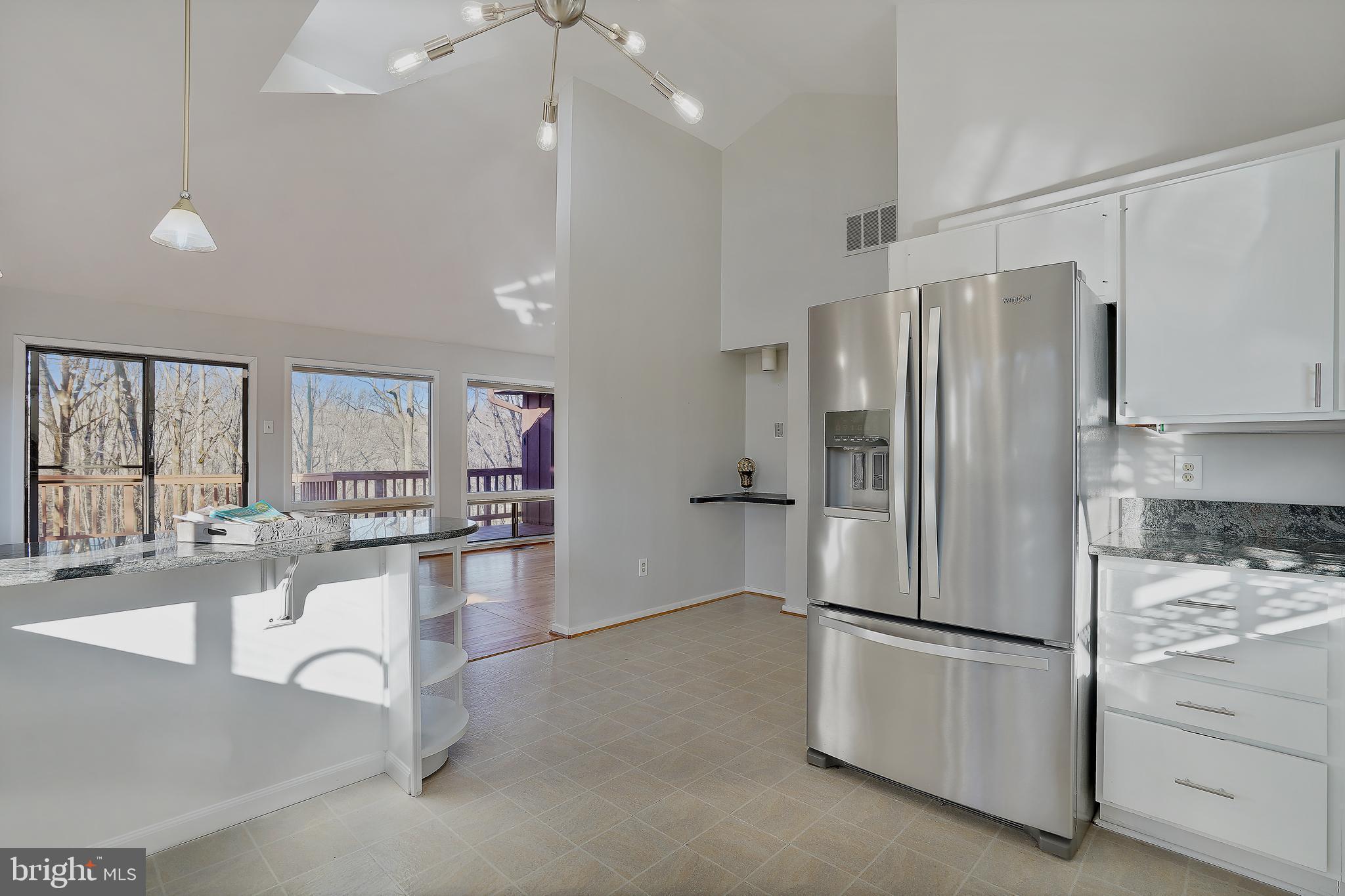 1052 Bellview Road McLean, VA 22102 - Photo 8 of 36 a kitchen with refrigerator and cabinets