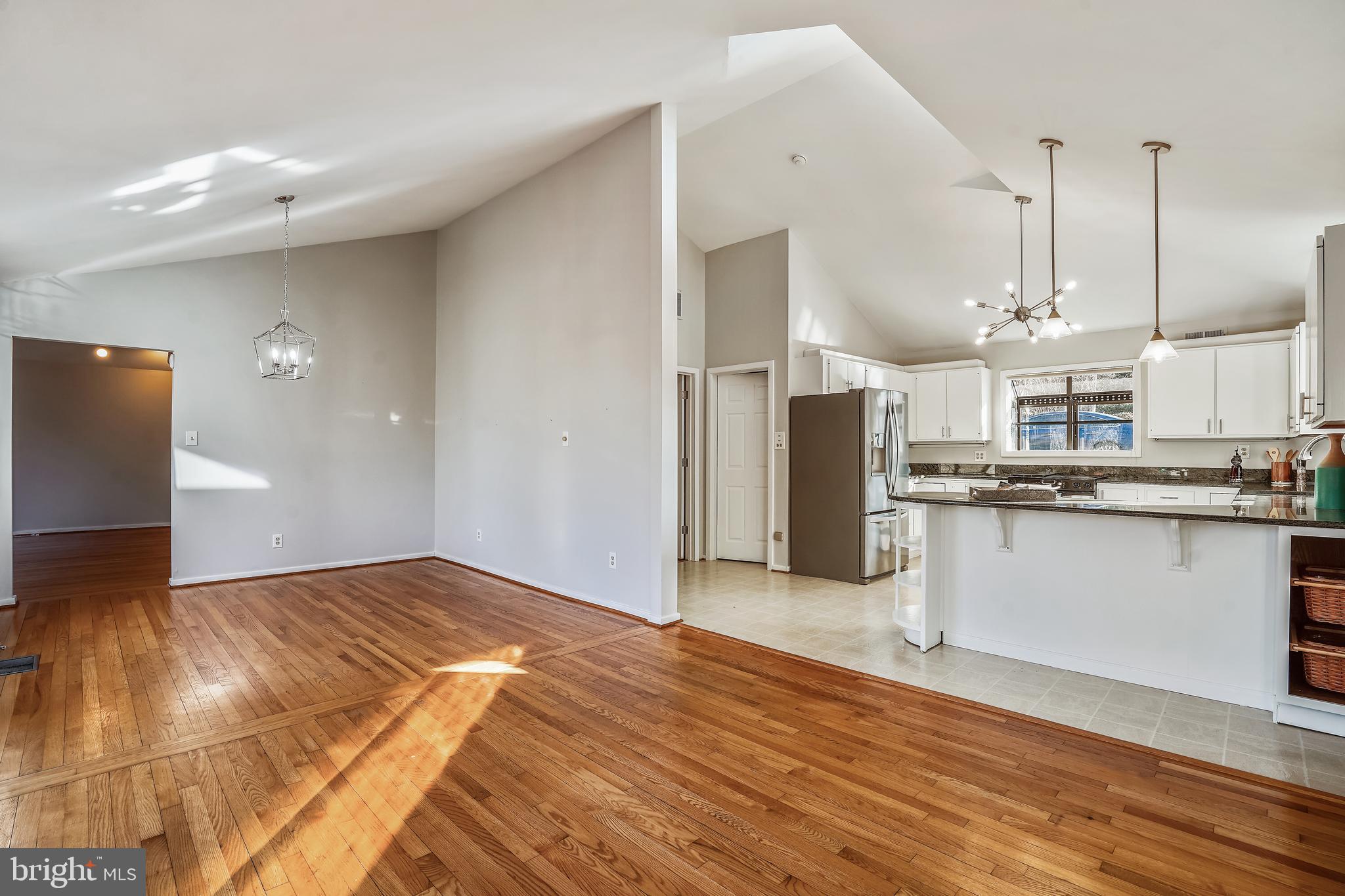 1052 Bellview Road McLean, VA 22102 - Photo 10 of 36 a view of kitchen with refrigerator stove and wooden floor