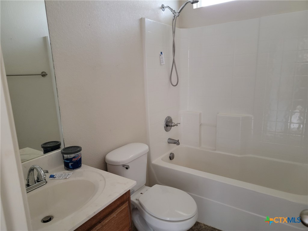 3505 Logsdon Street Copperas Cove, TX 76522 - Photo 12 of 17 a bathroom with a sink toilet and shower