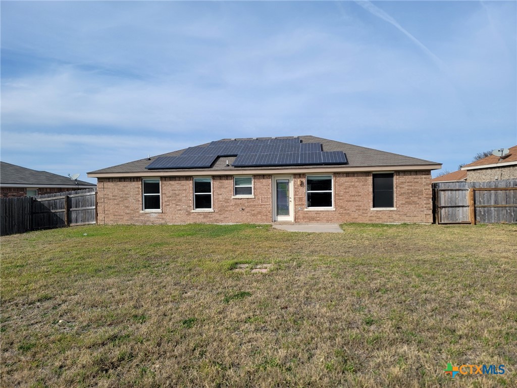 3505 Logsdon Street Copperas Cove, TX 76522 - Photo 15 of 17 a view of a yard in front of a house with a large tree