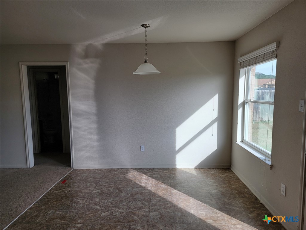 3505 Logsdon Street Copperas Cove, TX 76522 - Photo 7 of 17 an empty room with windows and closet