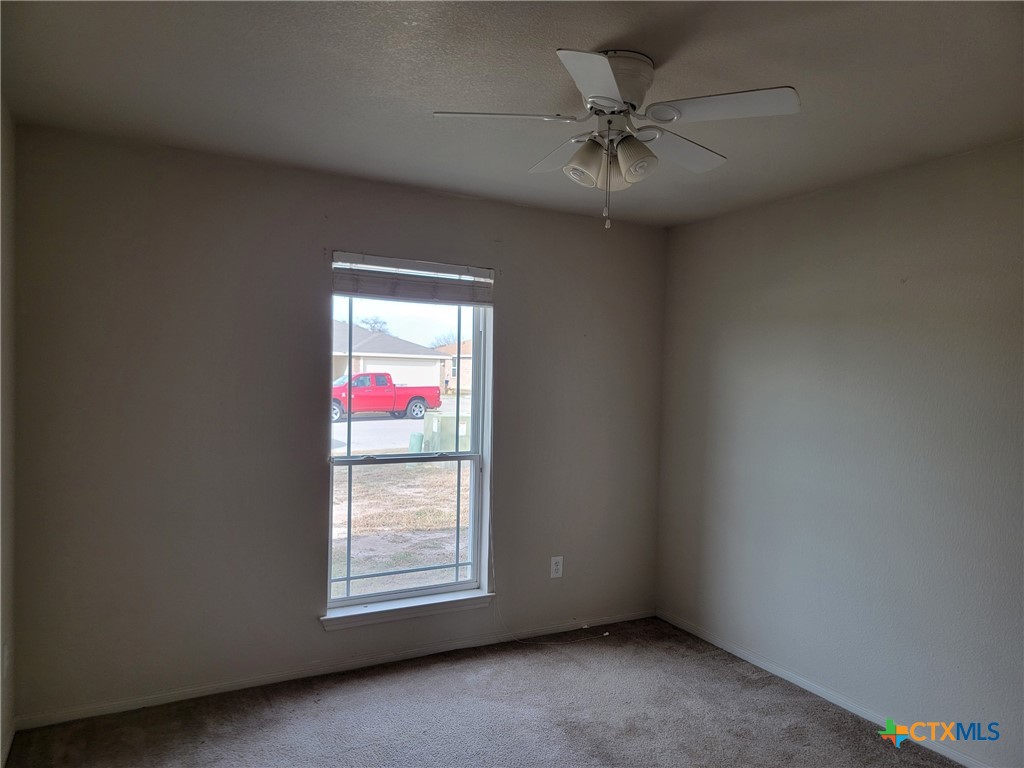 3505 Logsdon Street Copperas Cove, TX 76522 - Photo 9 of 17 an empty room with windows and fan