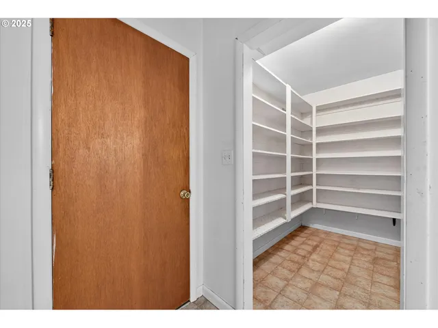 a view of an empty room and a window