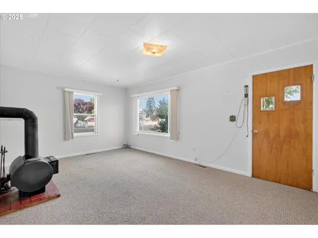 a view of a livingroom with furniture and window