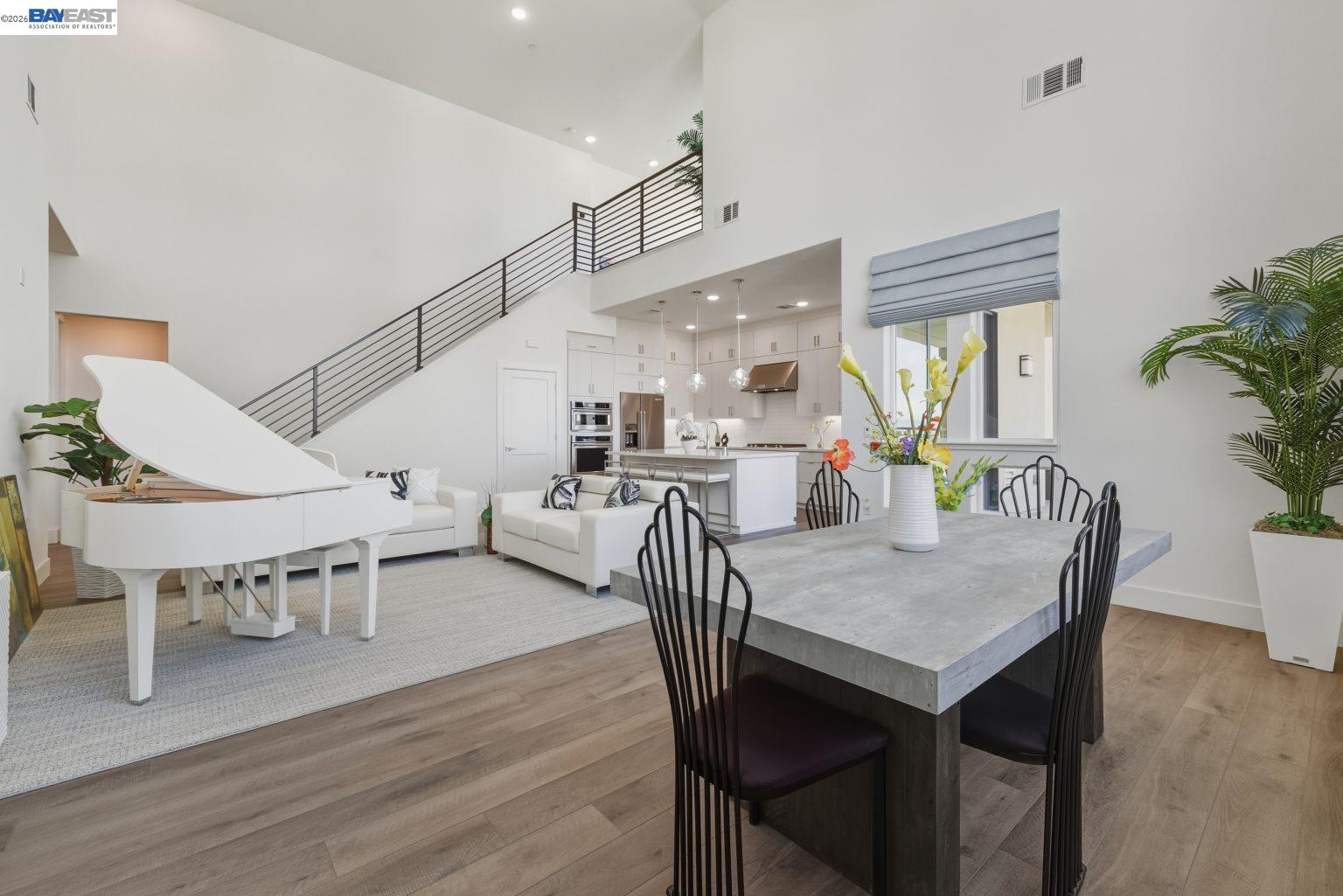 1748 Kilowatt Way, Unit 402 Fremont, CA 94539 - Photo 13 of 60 a dining room with furniture and wooden floor