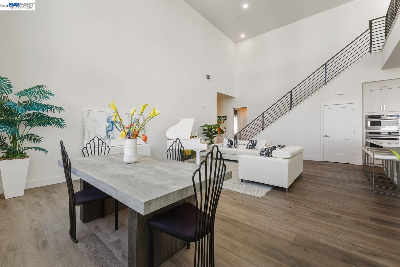 1748 Kilowatt Way, Unit 402 Fremont, CA 94539 - Photo 15 of 60 a view of a dining room with furniture and wooden floor
