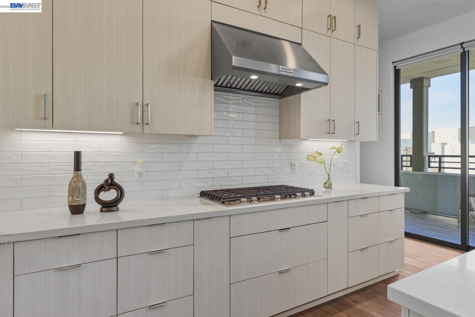 1748 Kilowatt Way, Unit 402 Fremont, CA 94539 - Photo 16 of 60 a kitchen with stainless steel appliances granite countertop a sink stove and cabinets