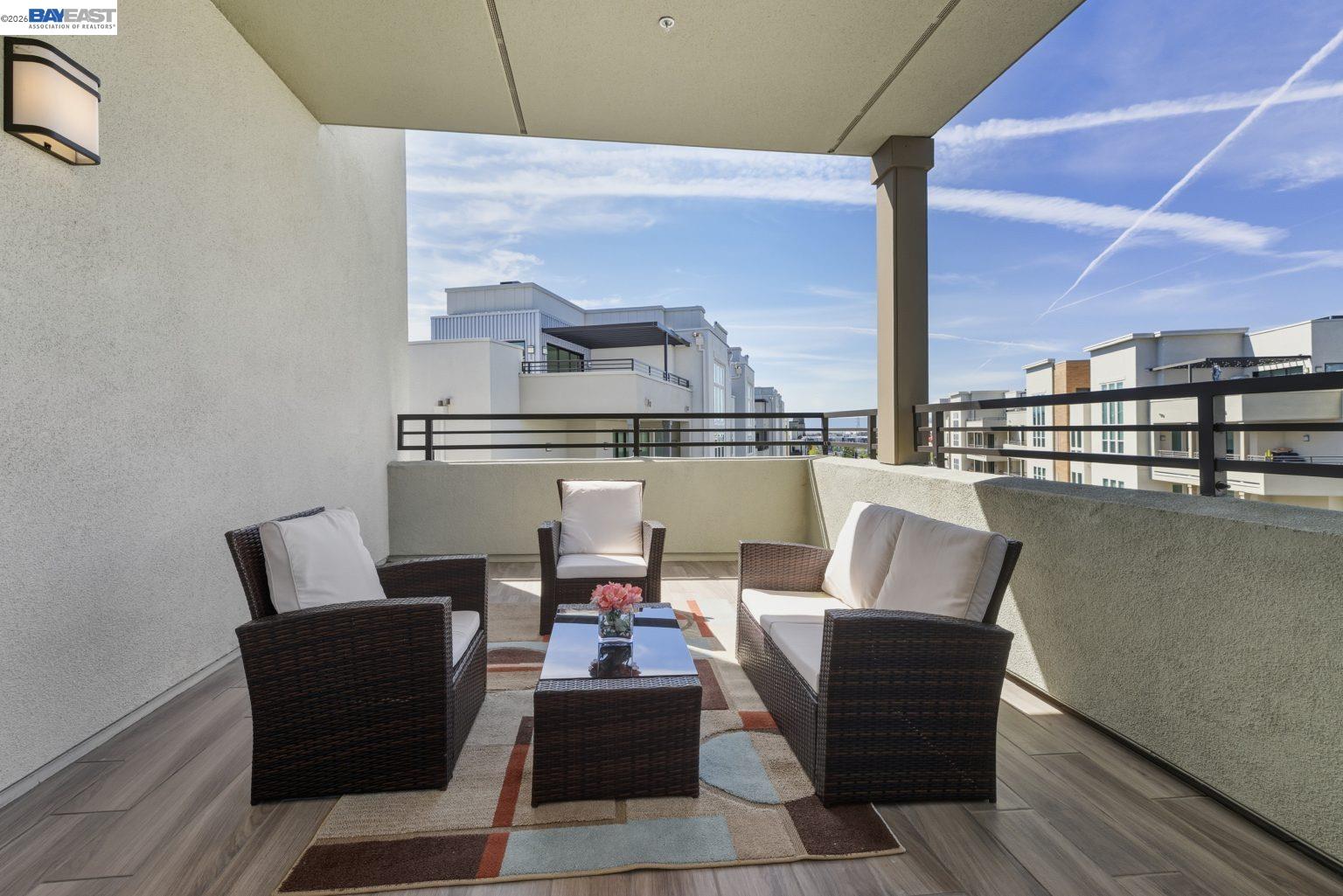 1748 Kilowatt Way, Unit 402 Fremont, CA 94539 - Photo 22 of 60 a living room with furniture and a table