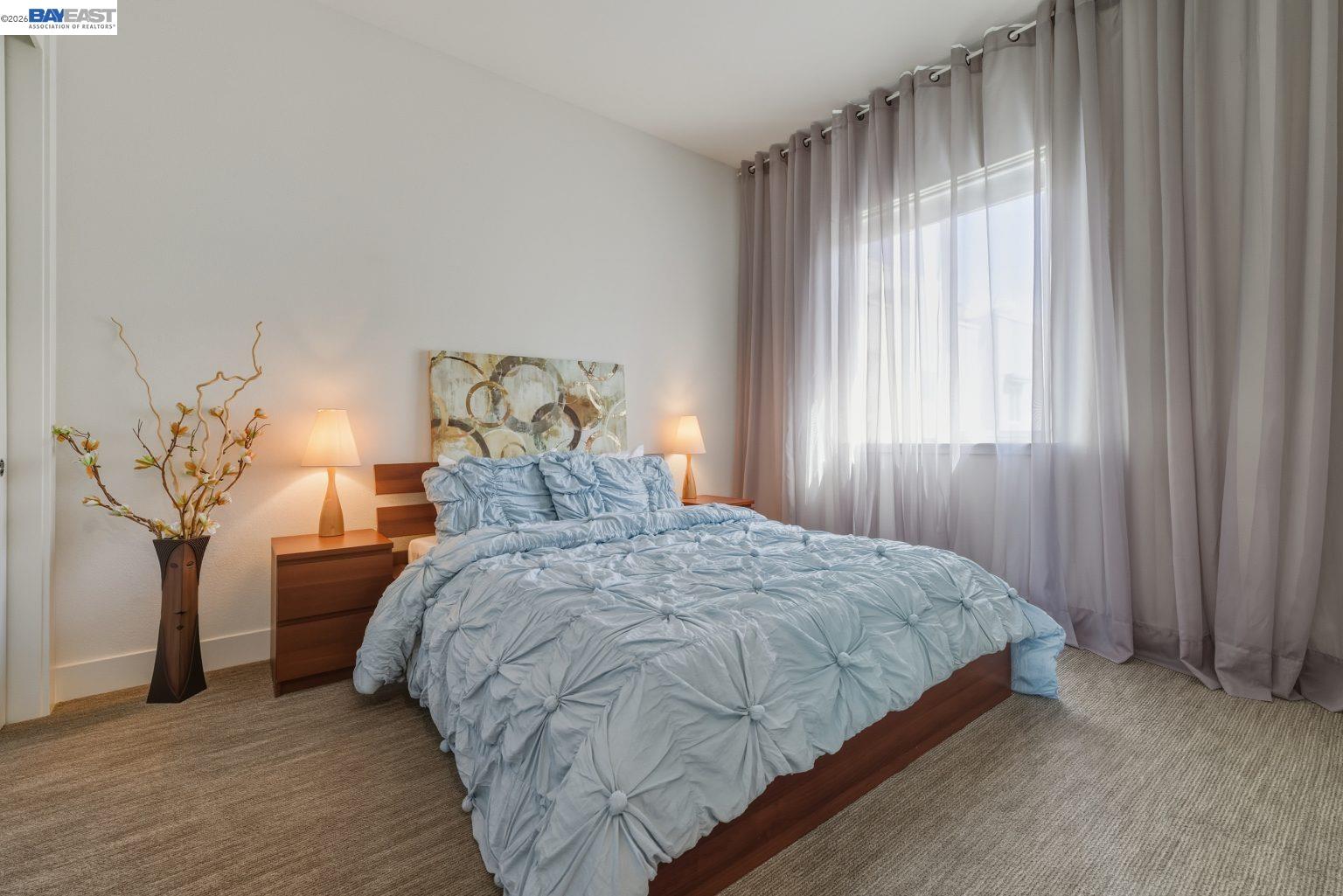 1748 Kilowatt Way, Unit 402 Fremont, CA 94539 - Photo 25 of 60 a bedroom with a bed and large windows