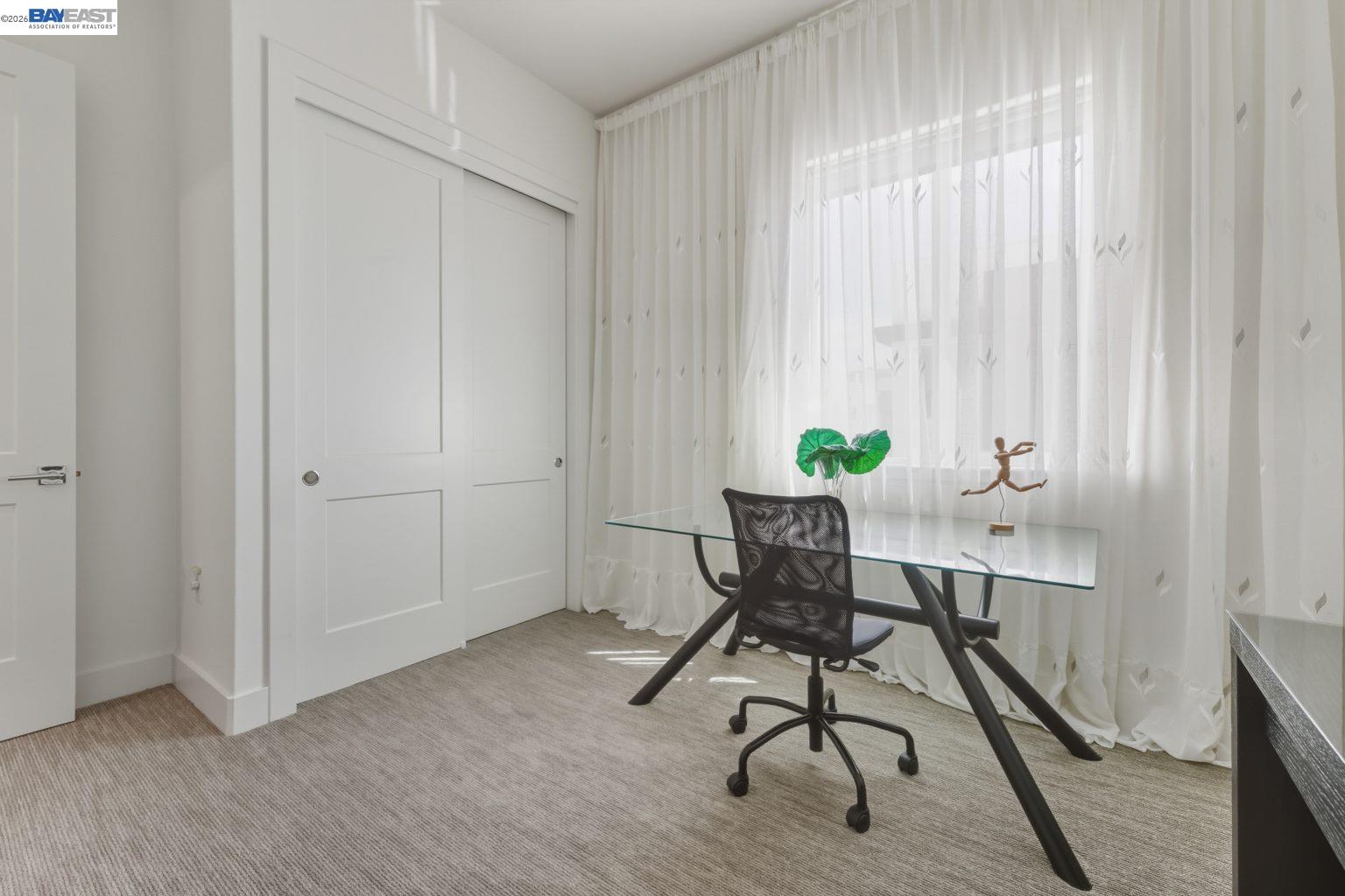 1748 Kilowatt Way, Unit 402 Fremont, CA 94539 - Photo 28 of 60 a view of a workspace with furniture and wooden floor