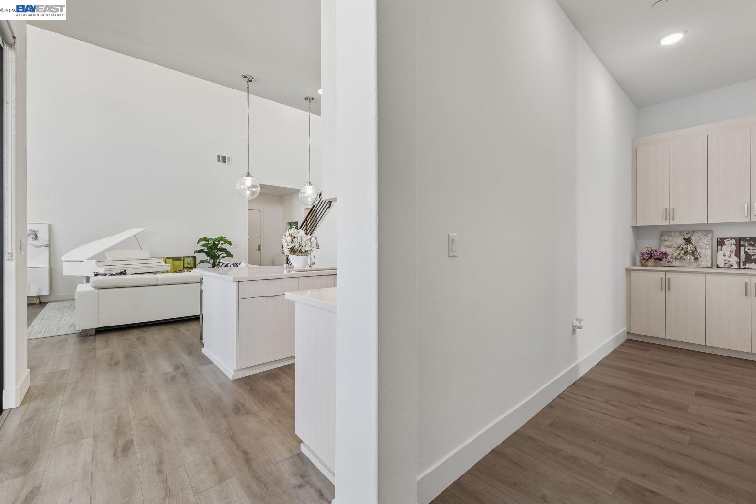 1748 Kilowatt Way, Unit 402 Fremont, CA 94539 - Photo 31 of 60 a view of a kitchen with white cabinets and white appliances