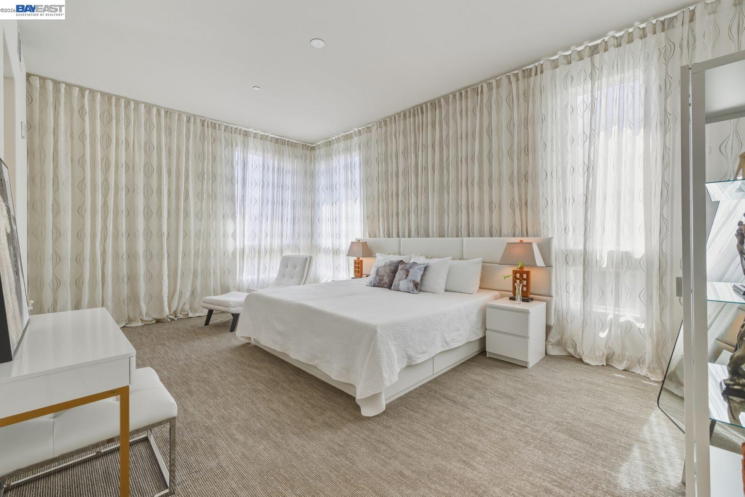 1748 Kilowatt Way, Unit 402 Fremont, CA 94539 - Photo 33 of 60 a bed room with a bed and a chair