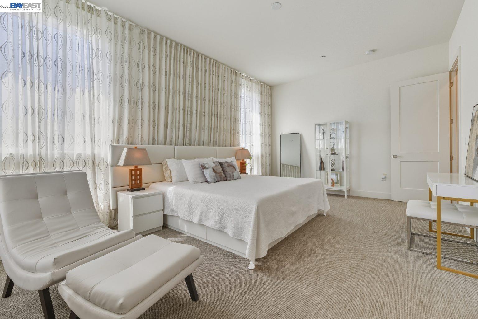 1748 Kilowatt Way, Unit 402 Fremont, CA 94539 - Photo 35 of 60 a bed room with a bed and a chair