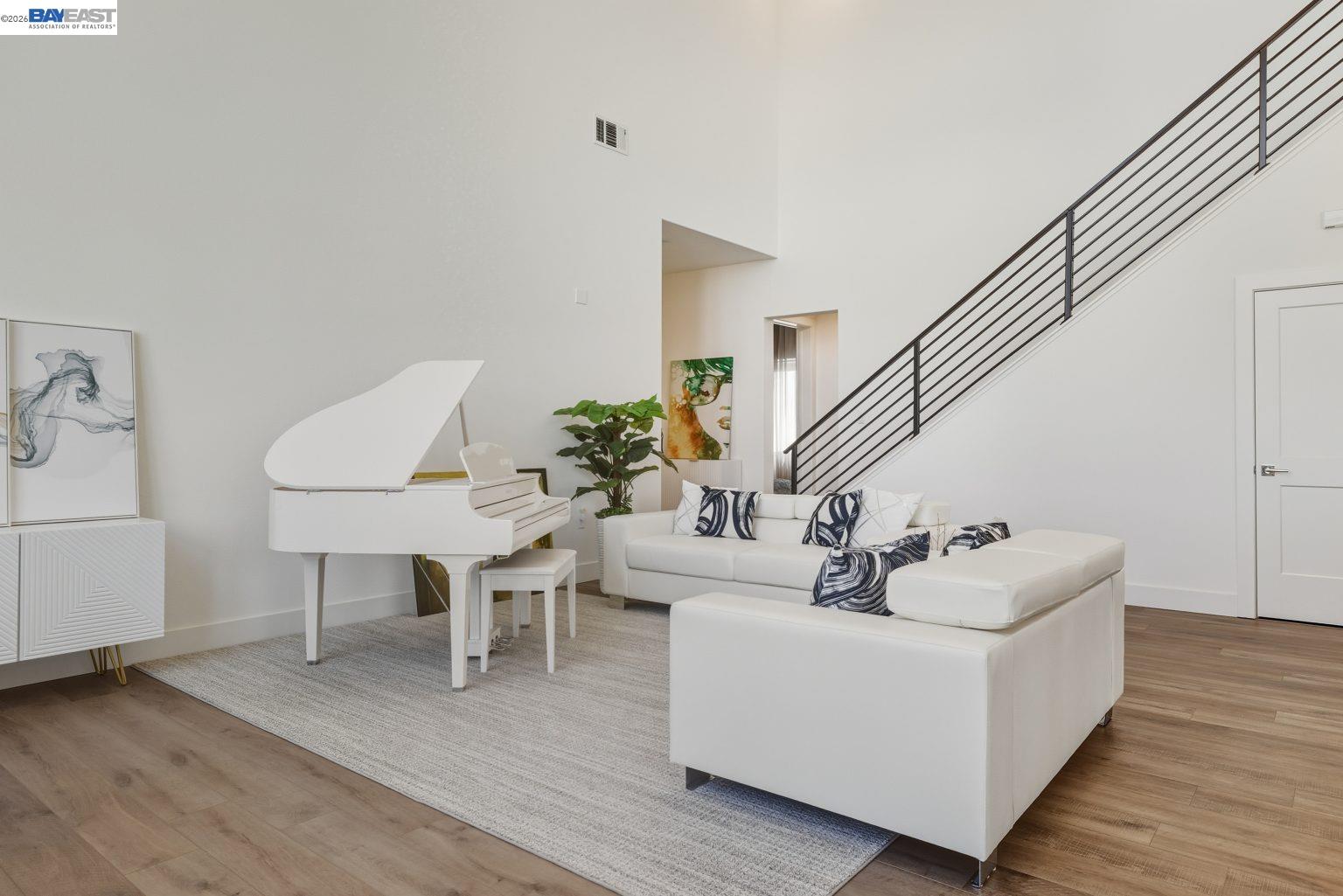 1748 Kilowatt Way, Unit 402 Fremont, CA 94539 - Photo 8 of 60 a living room with furniture and a wooden floor