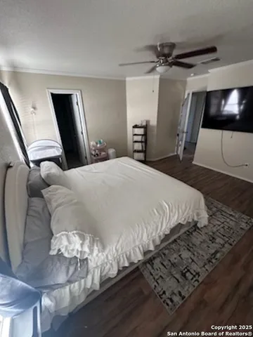 a bedroom with a bed and a mirror
