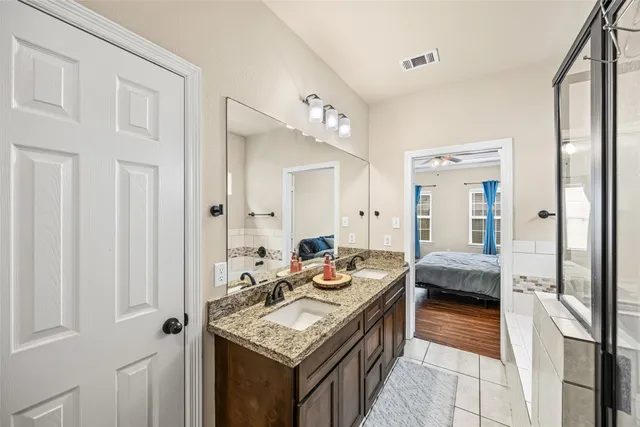 a living room with stainless steel appliances granite countertop furniture and a kitchen view