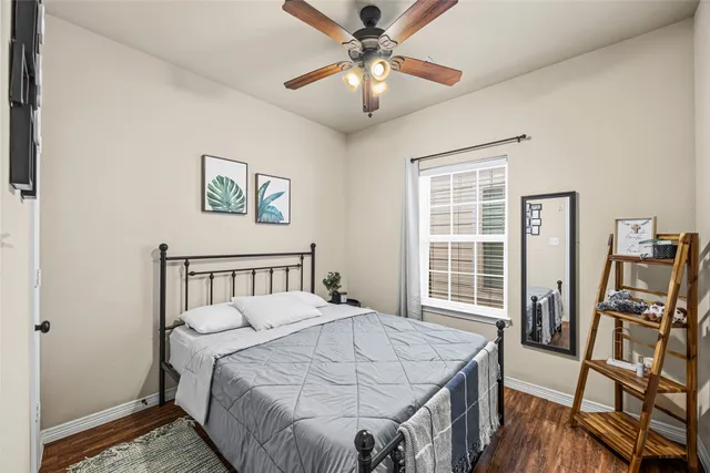 a bedroom with a bed and a table