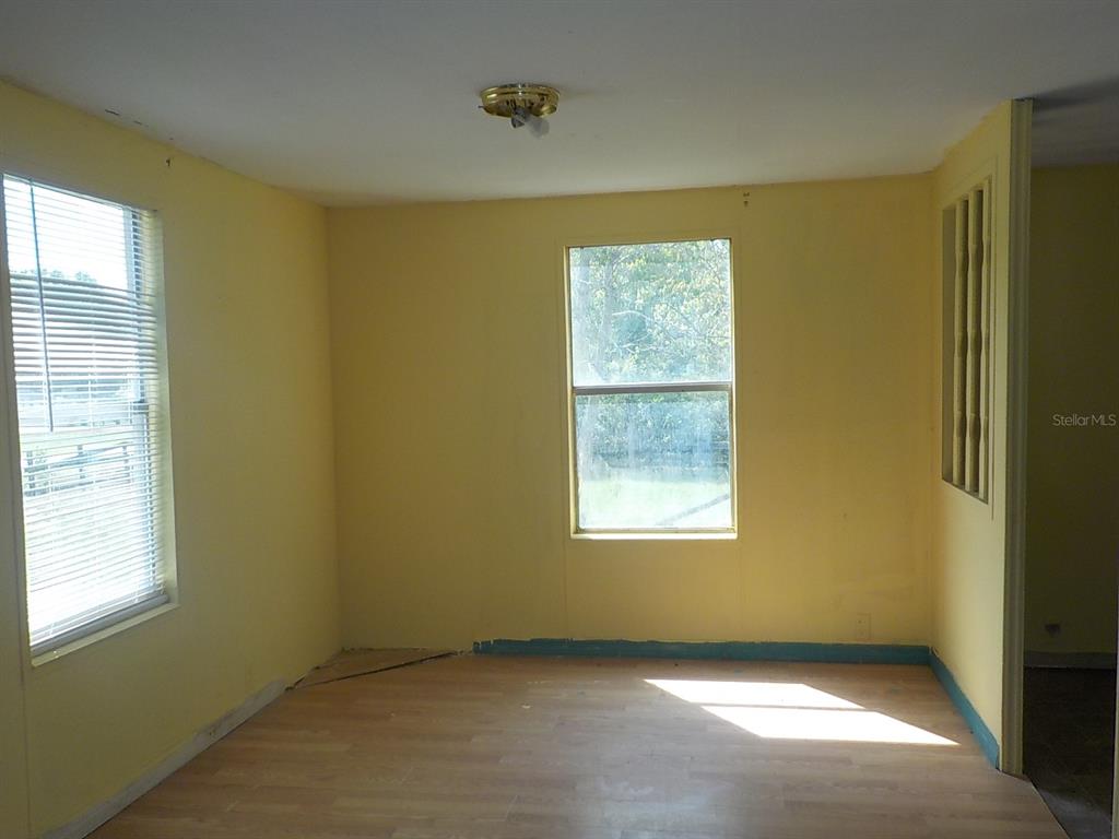 7445 Southwest 15th Place Ocala, FL 34474 - Photo 13 of 27 a view of an empty room with a window
