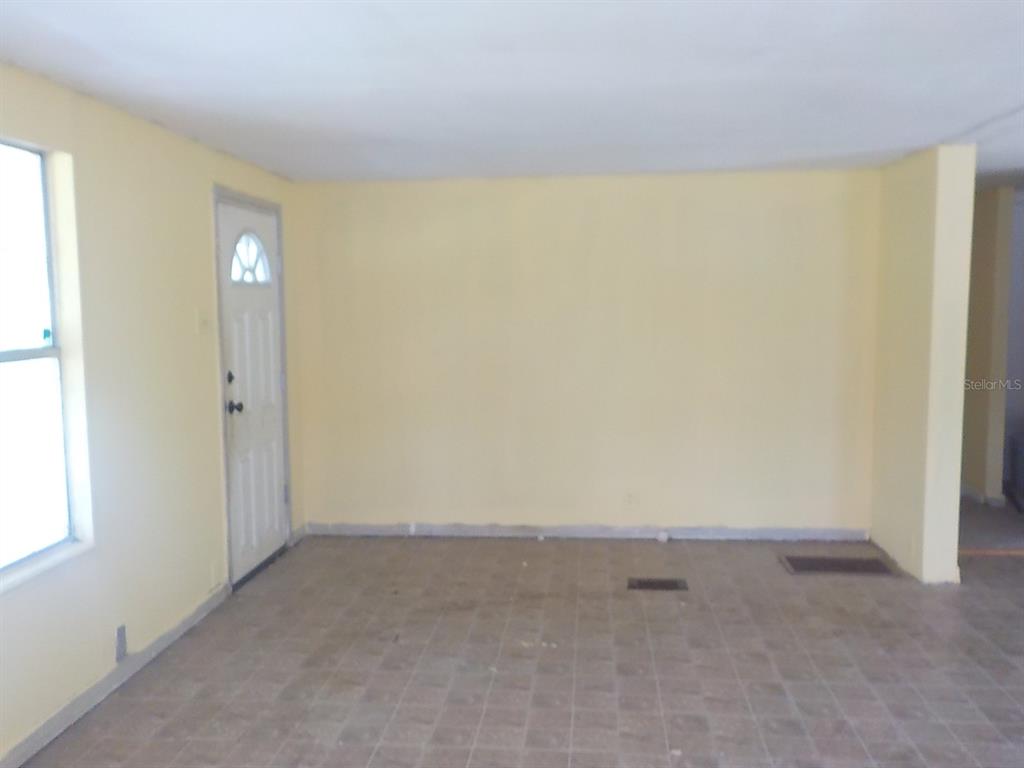 7445 Southwest 15th Place Ocala, FL 34474 - Photo 15 of 27 an empty room with windows and closet