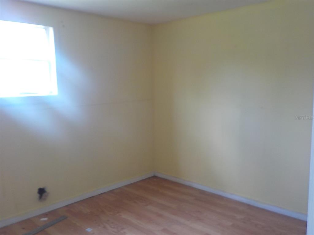 7445 Southwest 15th Place Ocala, FL 34474 - Photo 16 of 27 an empty room with a window
