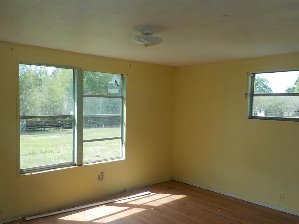 7445 Southwest 15th Place Ocala, FL 34474 - Photo 18 of 27 a view of empty room with window