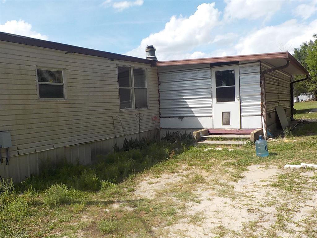 7445 Southwest 15th Place Ocala, FL 34474 - Photo 3 of 27 a view of backyard of house