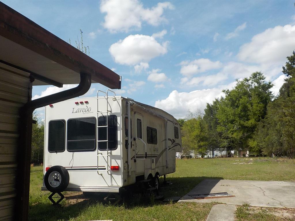7445 Southwest 15th Place Ocala, FL 34474 - Photo 6 of 27 a view of a porch with a yard