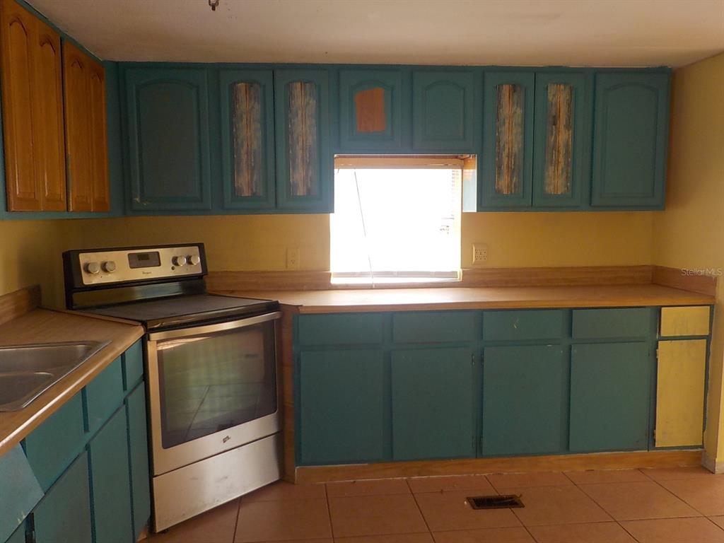 7445 Southwest 15th Place Ocala, FL 34474 - Photo 10 of 27 a kitchen with a cabinets and a sink