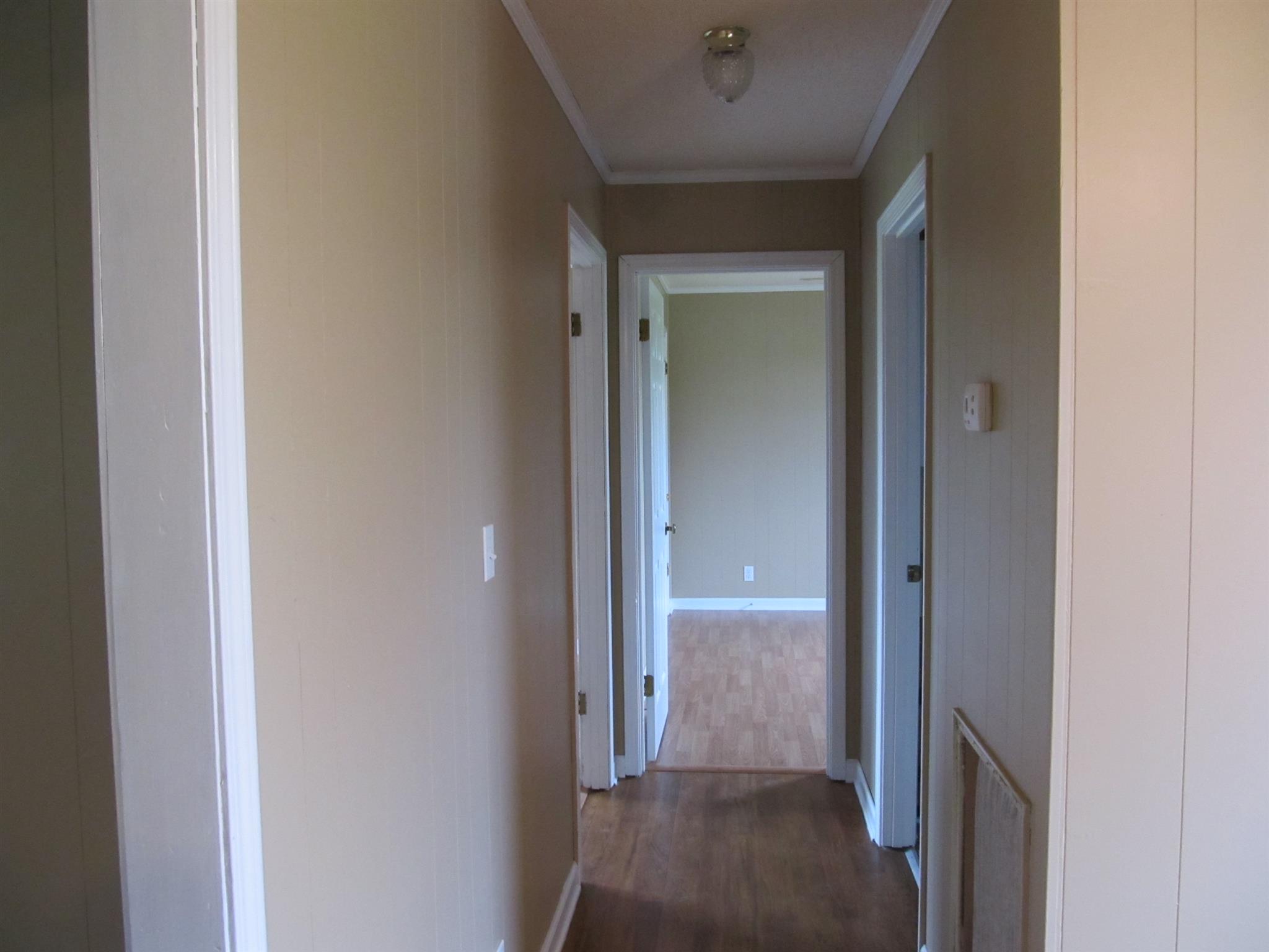 5452 Marion Road Cunningham, TN 37052 - Photo 8 of 15 a view of a hallway with wooden floor
