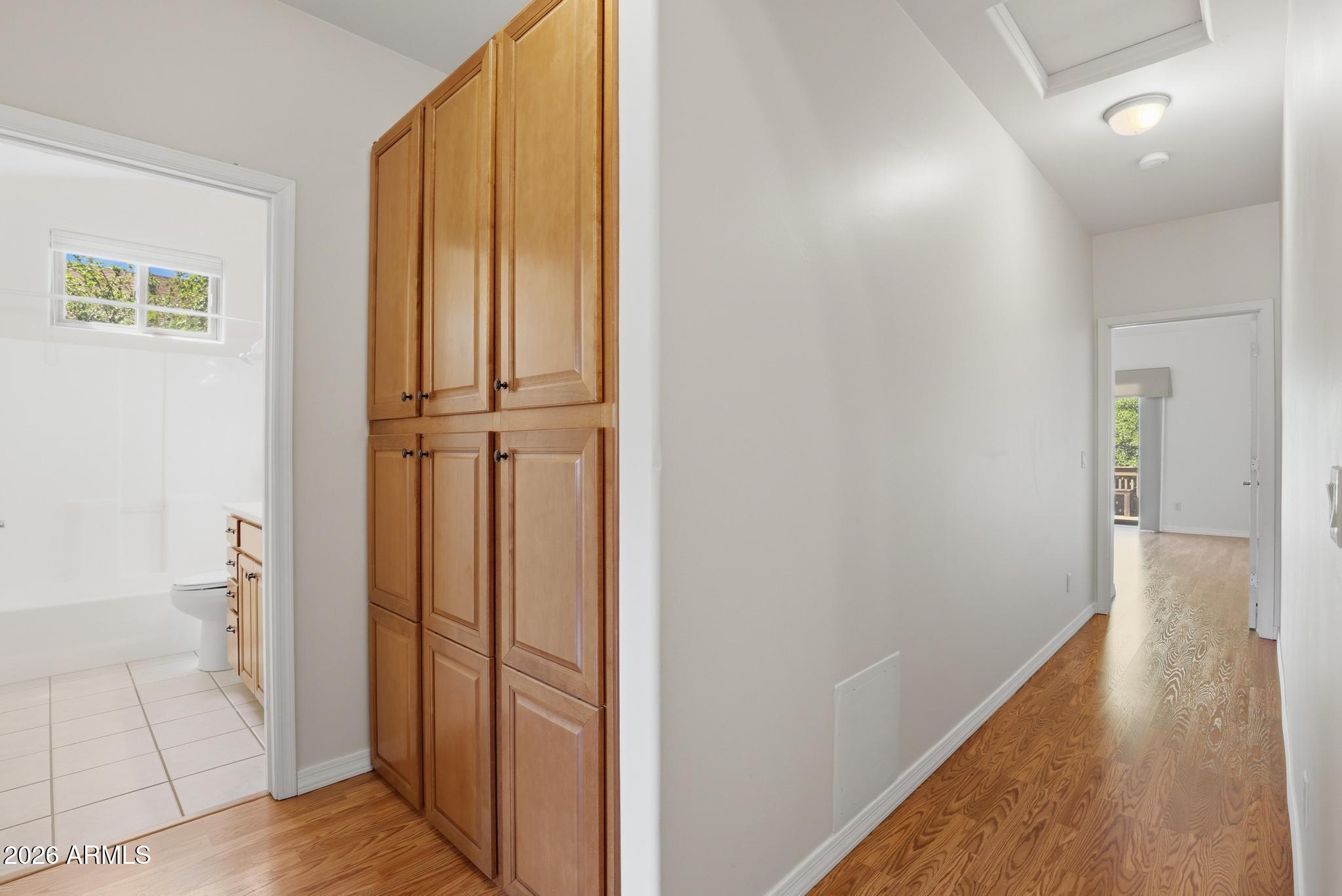 408 East Phoenix Street Payson, AZ 85541 - Photo 17 of 35 a view of a hallway with wooden floor and a bathroom