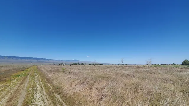 a view of a door and a window