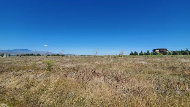a view of an outdoor space and a mountain view in back