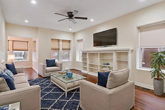 a living room with furniture fireplace and a flat screen tv