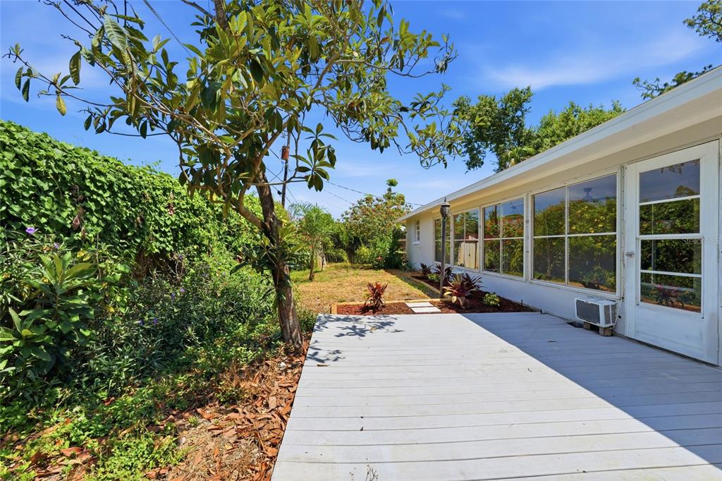 5984 Diana Road Venice, FL 34293 - Photo 28 of 36 a view of a patio with a table and chairs and potted plants