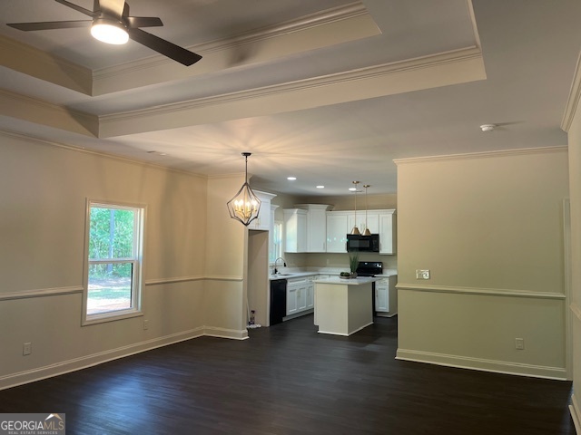 126 B&d Estates Road Milledgeville, GA 31061 - Photo 5 of 31 a view of a kitchen with a refrigerator wooden floor and a window