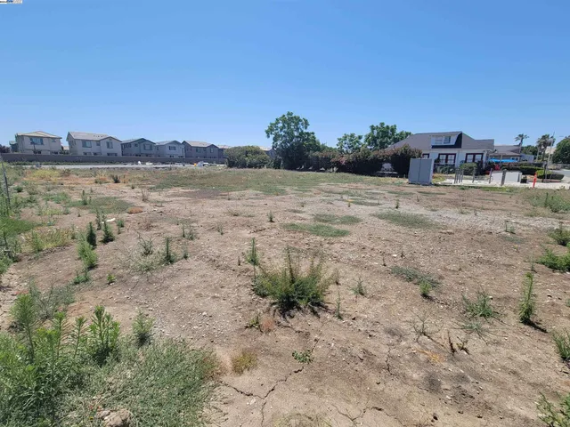 a view of a lake with beach and city view