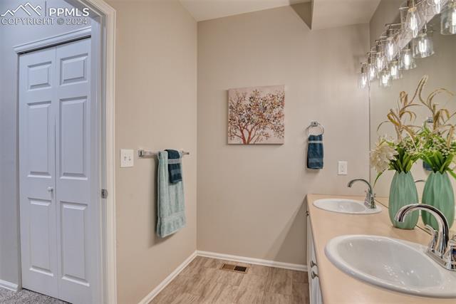 2002 Legacy Ridge View, Unit 101 Colorado Springs, CO 80910 - Photo 11 of 11 Bathroom featuring double vanity