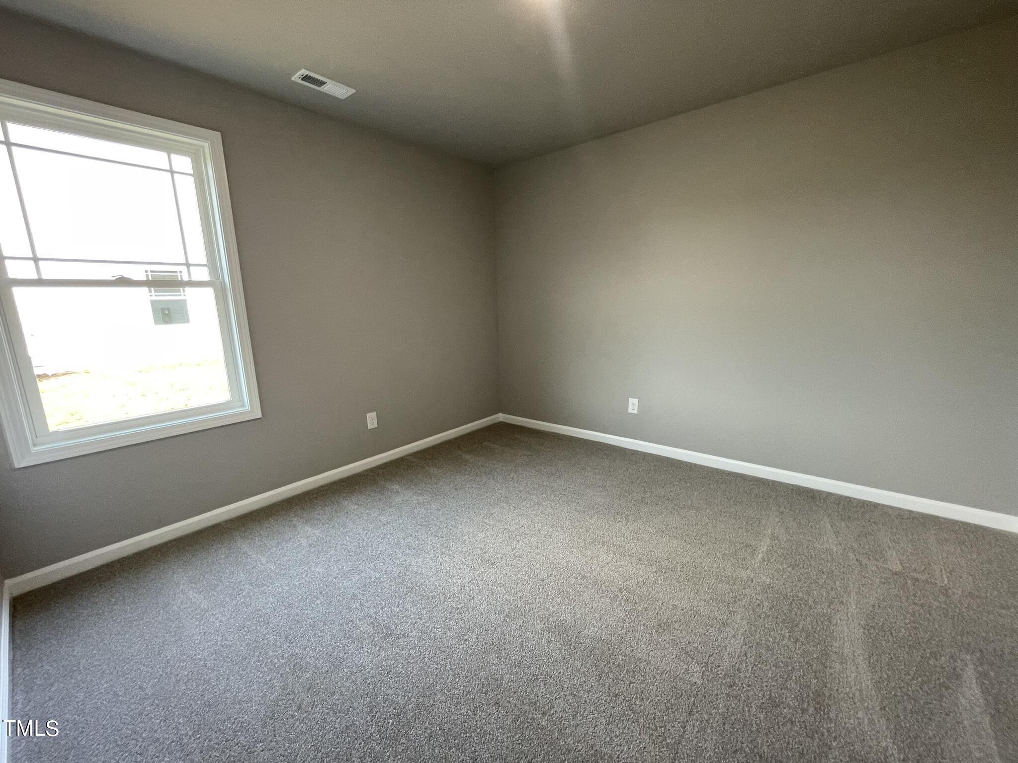 86 Scotties Ridge Drive Princeton, NC 27569 - Photo 15 of 19 an empty room with a window
